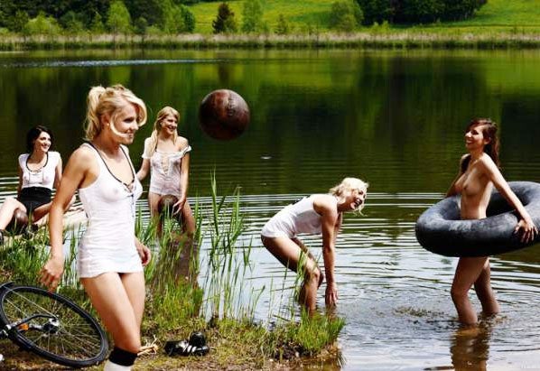 Attacking formation ... girls fool about in a lake for Playboy shoot Sacha Höchstetter for Playboy July 2011/(C)Playboy