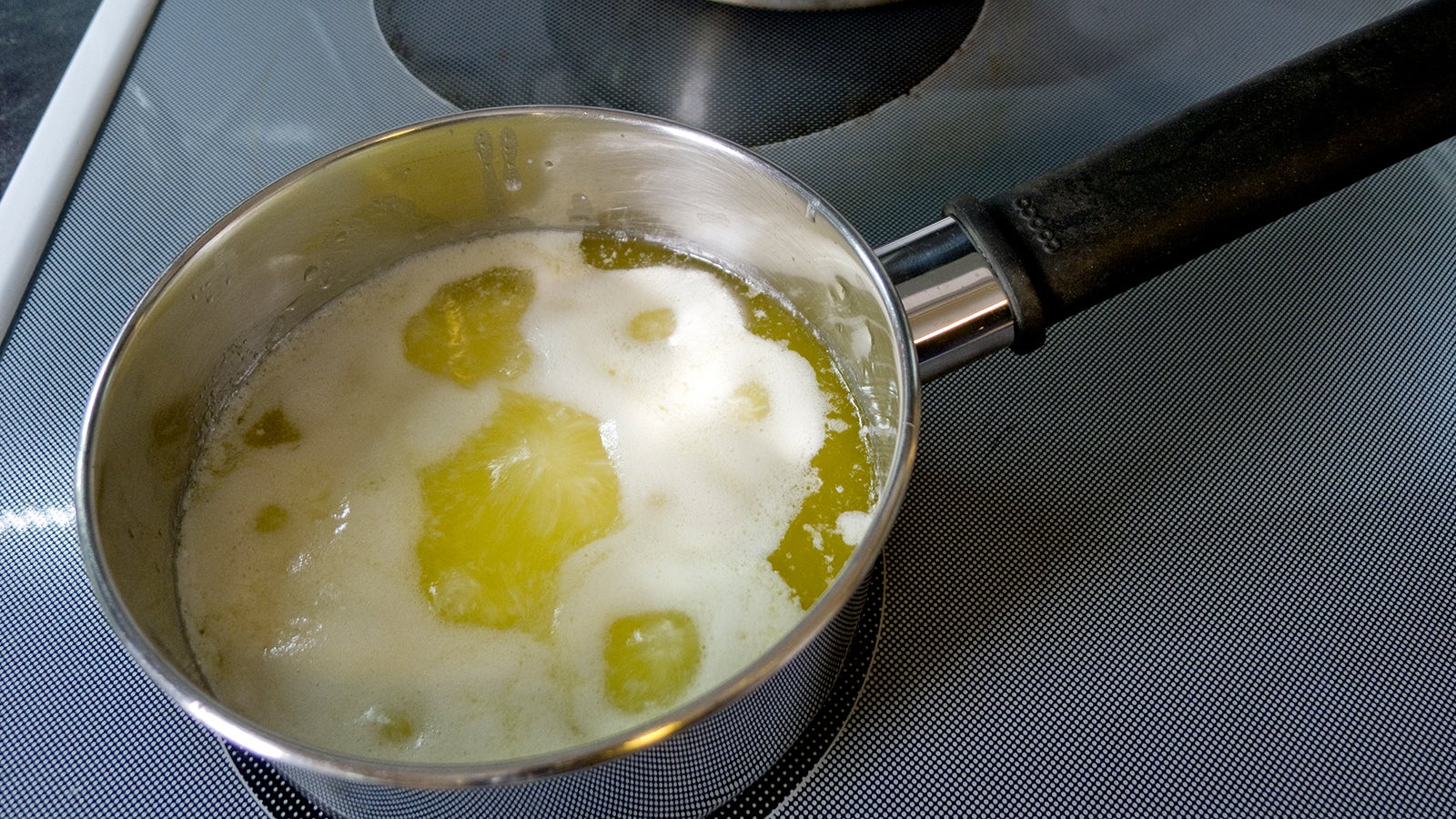 Ghee milk solids cooking off by Larry Jacobsen