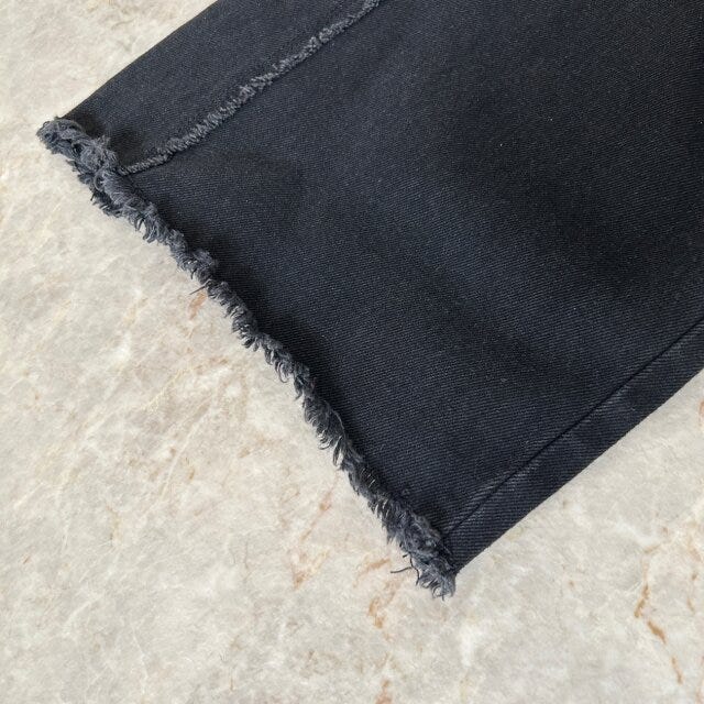 ウィメンズフレイサイドワイドデニムパンツの裾部分