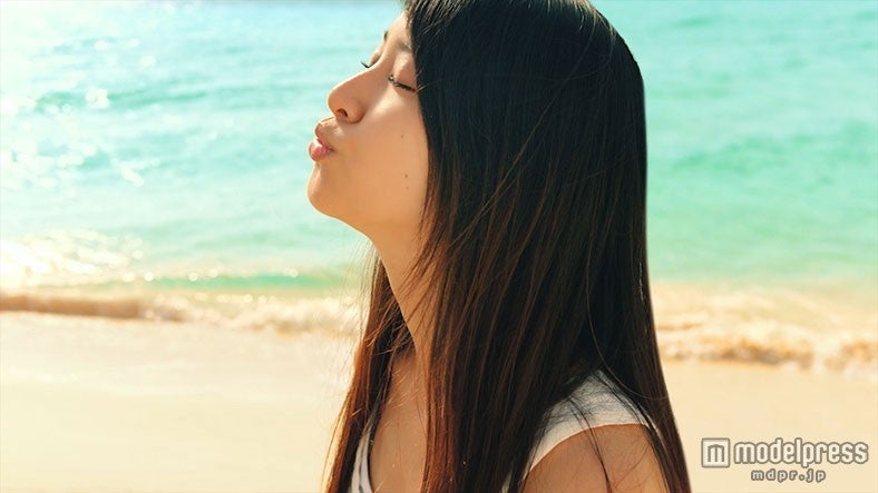 “チュー”と唇を突き出す